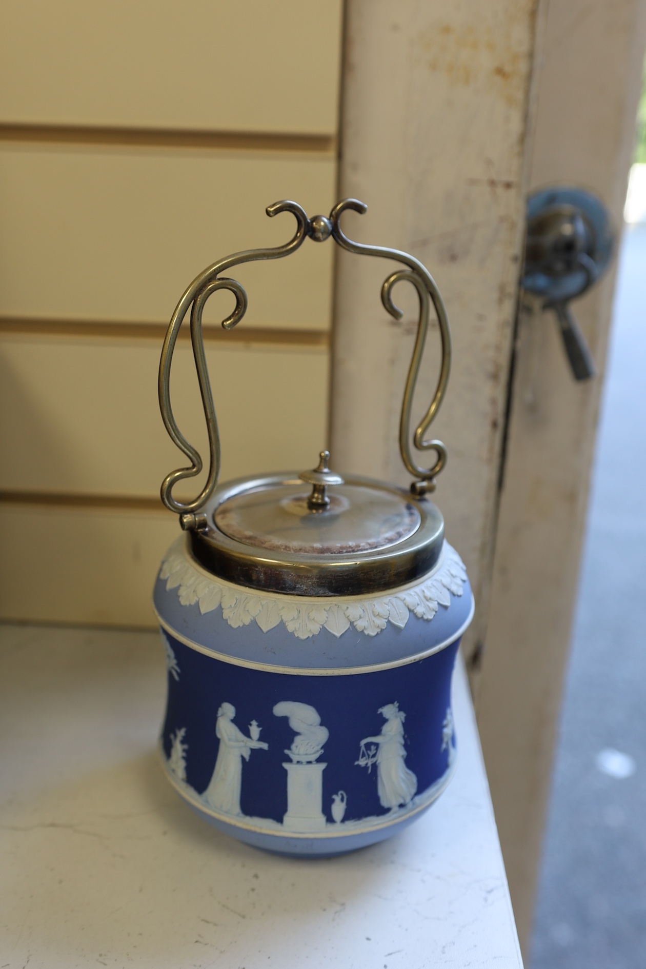 A Wedgwood three colour biscuit barrel with plated rim and handle, a Royal Worcester cup and saucer and a Dresden shaped bowl, biscuit barrel 17cm high. Condition - good